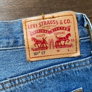Levi’s 501 mid-rise medium wash jeans